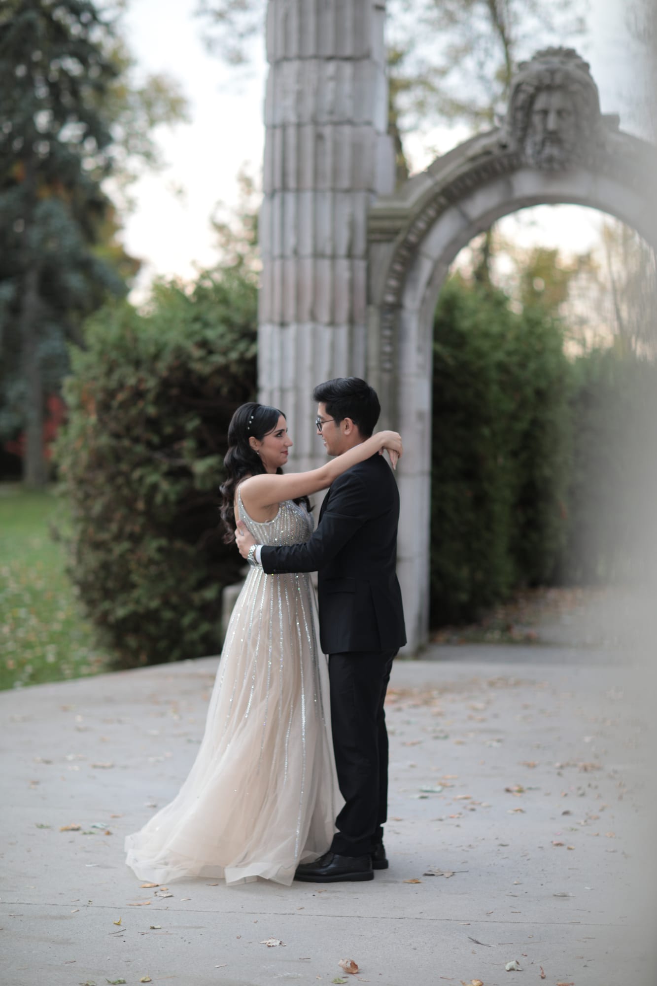 Bride and groom embracing at golden hour